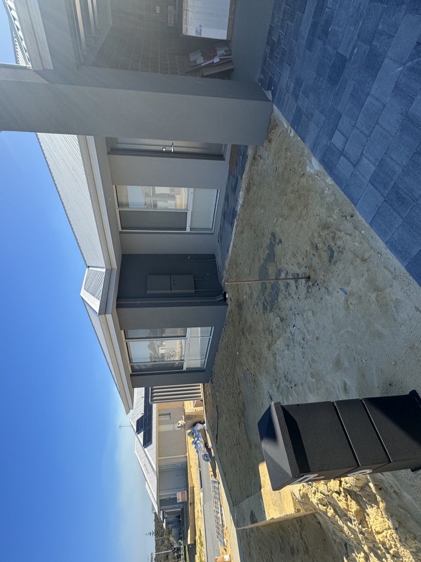 Bare sand front yard at a new build.